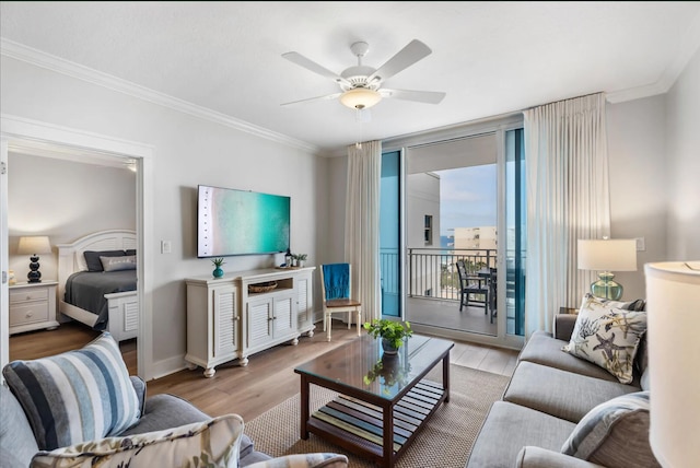 1110 Santa Rosa Blvd Unit A616, Fort Walton Beach, FL 32548 - living room featuring floor to ceiling windows, wood finished floors, a ceiling fan, crown molding, and baseboards