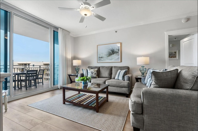 1110 Santa Rosa Blvd Unit A616, Fort Walton Beach, FL 32548 - living area with ornamental molding, floor to ceiling windows, light wood-type flooring, and ceiling fan