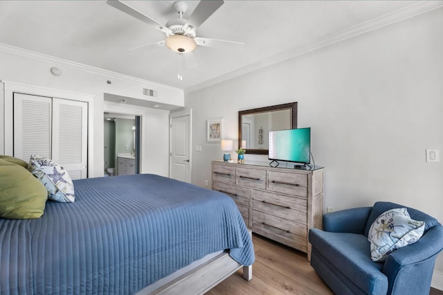 1110 Santa Rosa Blvd Unit A616, Fort Walton Beach, FL 32548 - bedroom with ornamental molding, wood finished floors, visible vents, and a closet