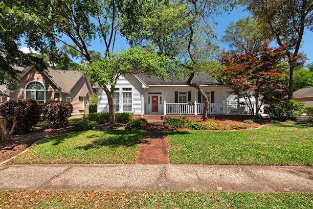 view of front of house with covered porch and a front yard