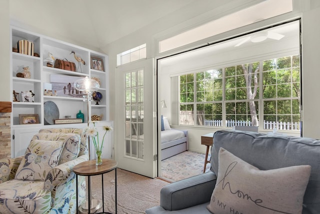 sitting room featuring ceiling fan and built in features