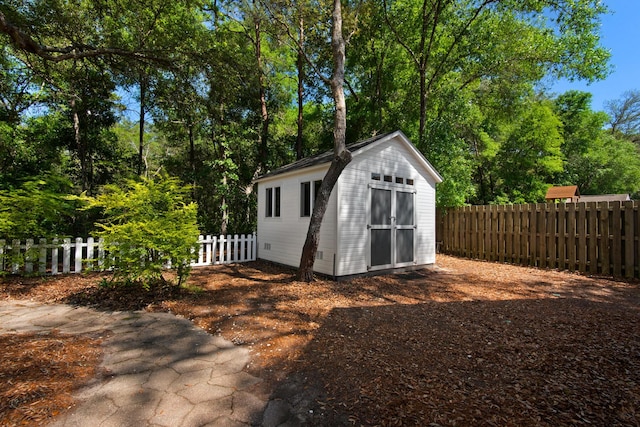 view of shed featuring a fenced backyard