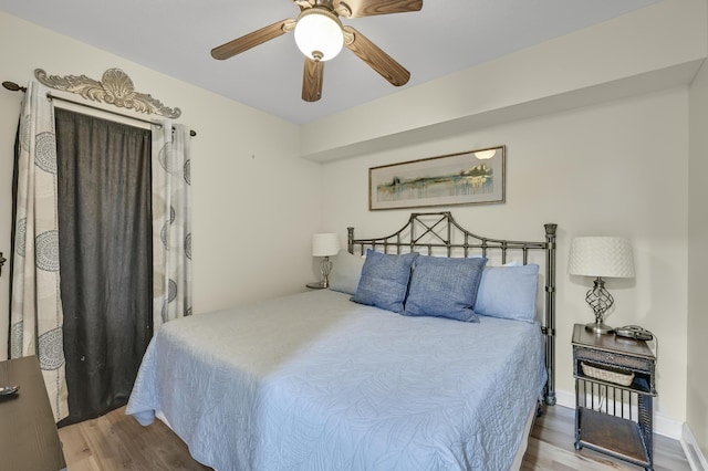 1751 Scenic Highway 98 Unit 212, Destin, FL 32541 - bedroom with wood finished floors and a ceiling fan