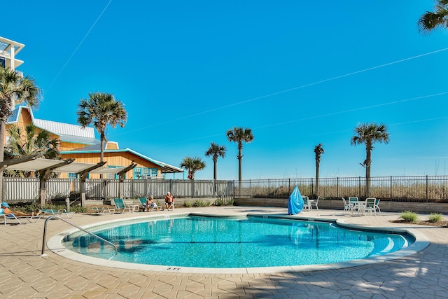 1751 Scenic Highway 98 Unit 212, Destin, FL 32541 - community pool featuring a patio and fence