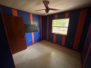 spare room featuring a ceiling fan