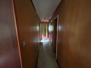 corridor with wooden walls