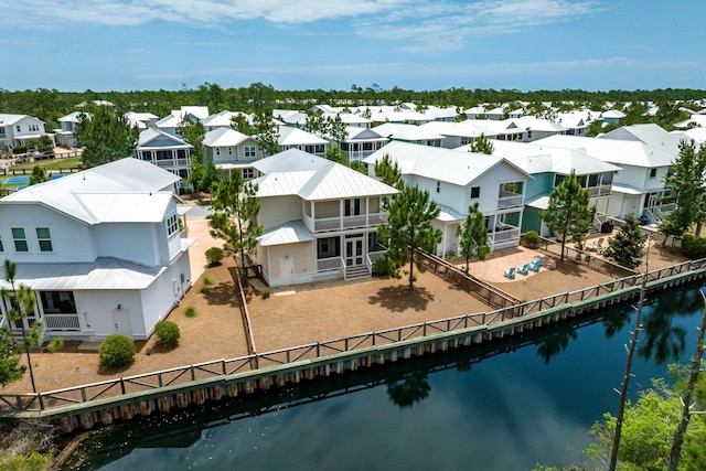 aerial view of residential area featuring a nearby body of water