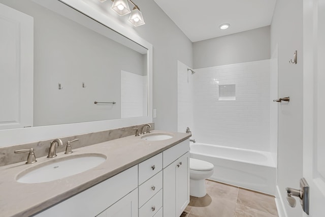 full bath featuring toilet, shower / bathtub combination, double vanity, and tile patterned flooring
