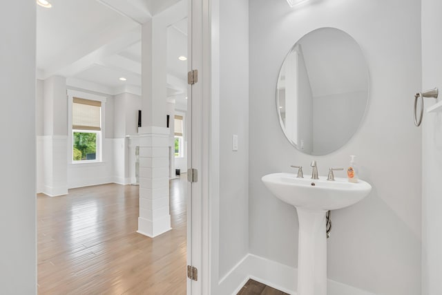 bathroom with wood finished floors, baseboards, and recessed lighting