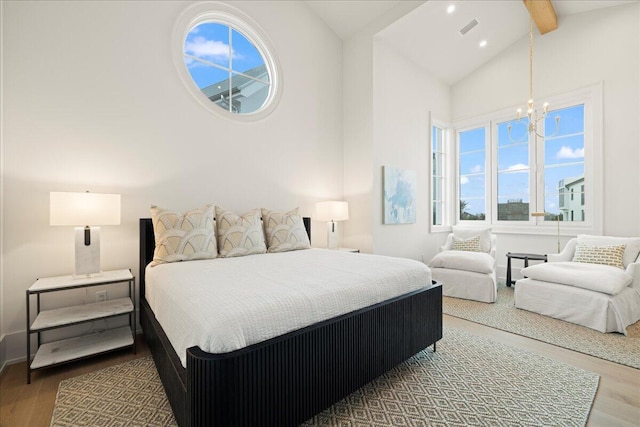 160 Heritage Dunes Ln S, Santa Rosa Beach, FL 32459 - bedroom with visible vents, a chandelier, high vaulted ceiling, wood finished floors, and beamed ceiling