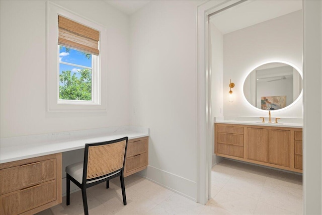 160 Heritage Dunes Ln S, Santa Rosa Beach, FL 32459 - home office featuring a sink, built in desk, and baseboards