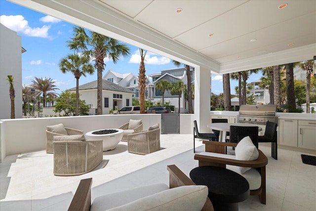 160 Heritage Dunes Ln S, Santa Rosa Beach, FL 32459 - view of patio / terrace with a residential view, an outdoor kitchen, a fire pit, and grilling area