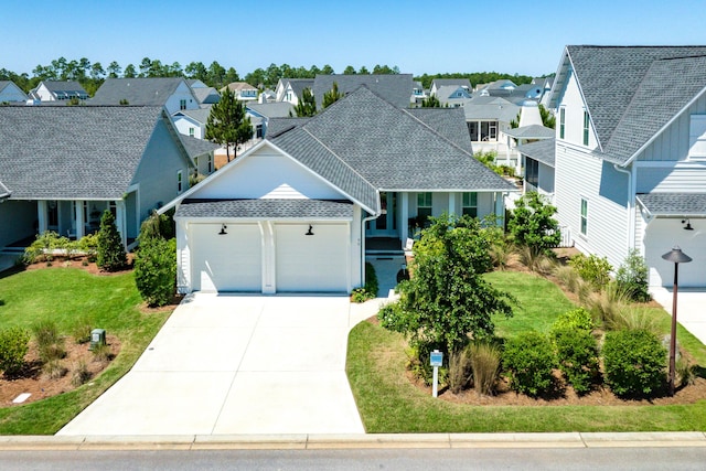 90 Basal St, Inlet Beach, FL 32461 - view of front of house featuring a residential view, an attached garage, concrete driveway, a front lawn, and a shingled roof