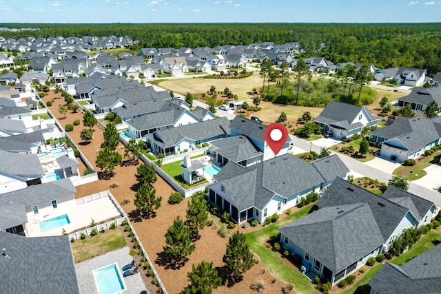 90 Basal St, Inlet Beach, FL 32461 - aerial perspective of suburban area featuring a pool area and a heavily wooded area