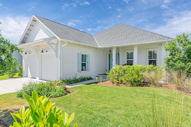 90 Basal St, Inlet Beach, FL 32461 - ranch-style home featuring roof with shingles, a garage, a front lawn, and driveway