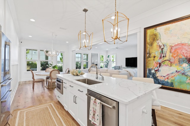 90 Basal St, Inlet Beach, FL 32461 - kitchen featuring a chandelier, a sink, stainless steel appliances, a kitchen island with sink, and light wood-style flooring