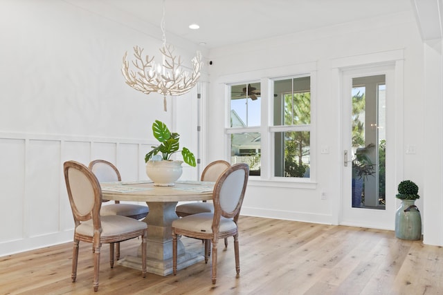 90 Basal St, Inlet Beach, FL 32461 - dining room with a decorative wall, a chandelier, and light wood-style floors