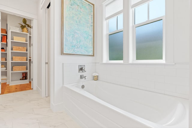 90 Basal St, Inlet Beach, FL 32461 - full bath with plenty of natural light, marble look tiles, a bath, and a spacious closet