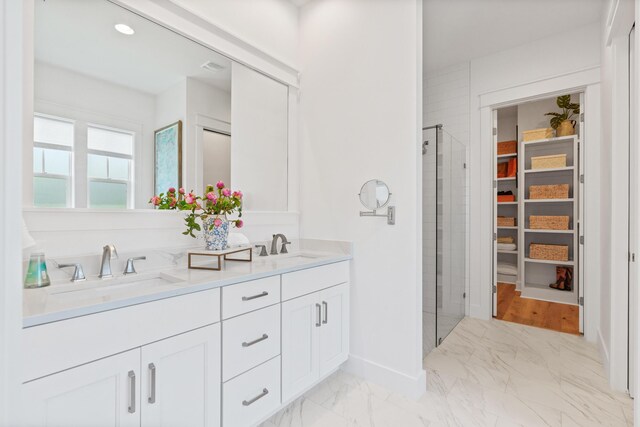 90 Basal St, Inlet Beach, FL 32461 - bathroom with a stall shower, marble finish floors, a spacious closet, double vanity, and recessed lighting