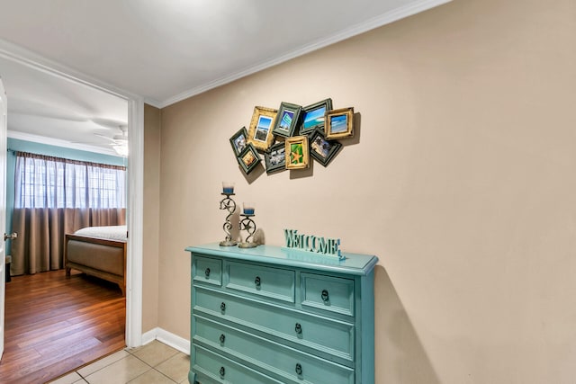 220 N Driftwood Bay Dr Unit 40A, Miramar Beach, FL 32550 - corridor with crown molding, baseboards, and light tile patterned floors