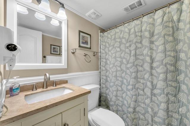 220 N Driftwood Bay Dr Unit 40A, Miramar Beach, FL 32550 - bathroom with ornamental molding, wainscoting, toilet, and visible vents