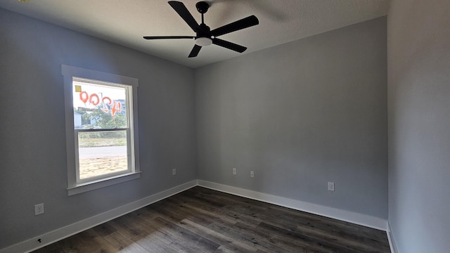 4200 Ida Coon Cir, Niceville, FL 32578 - empty room with dark wood-type flooring, ceiling fan, baseboards, and a textured ceiling