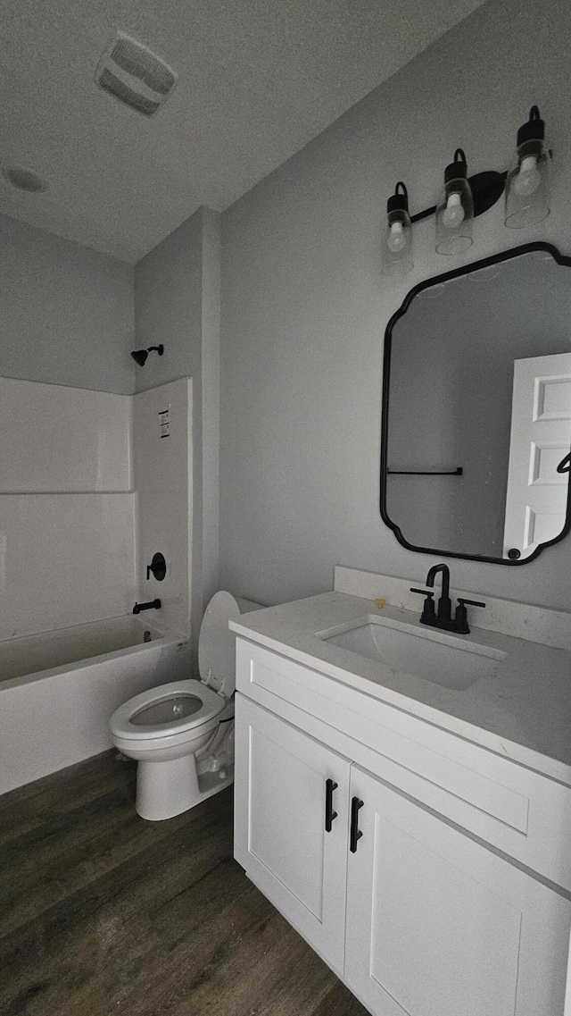4200 Ida Coon Cir, Niceville, FL 32578 - bathroom with wood finished floors, vanity, toilet, and washtub / shower combination