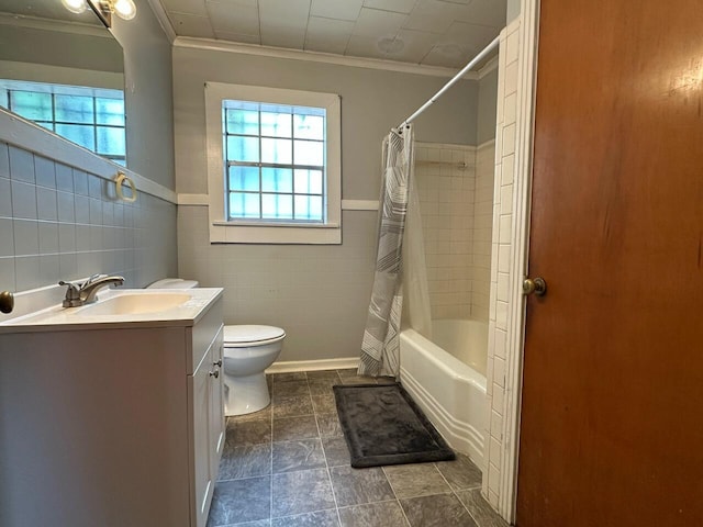 510 E Fisher St, Pensacola, FL 32503 - full bath featuring crown molding, shower / tub combo, toilet, tile walls, and vanity