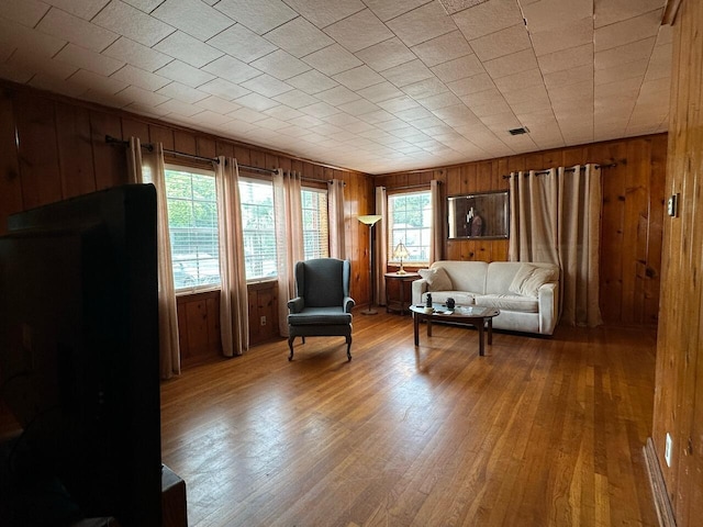 510 E Fisher St, Pensacola, FL 32503 - living area with light wood-style floors and wooden walls