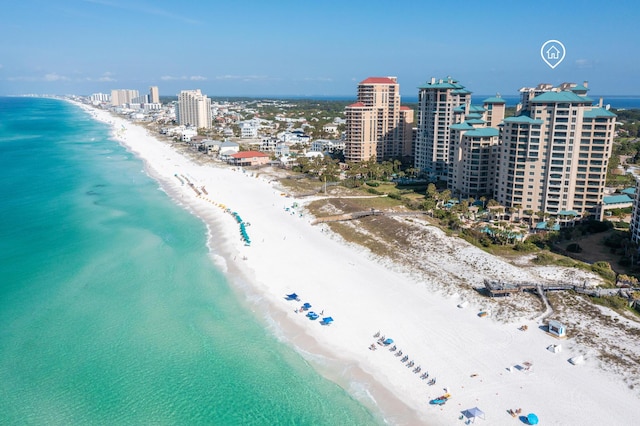 birds eye view of property with a water view and a view of the beach