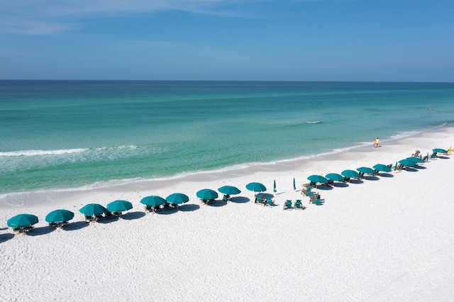 aerial view with a water view and a view of the beach