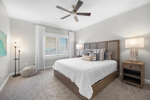 carpeted bedroom with crown molding, baseboards, and ceiling fan