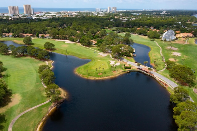 drone / aerial view featuring a city view, a water view, and golf course view