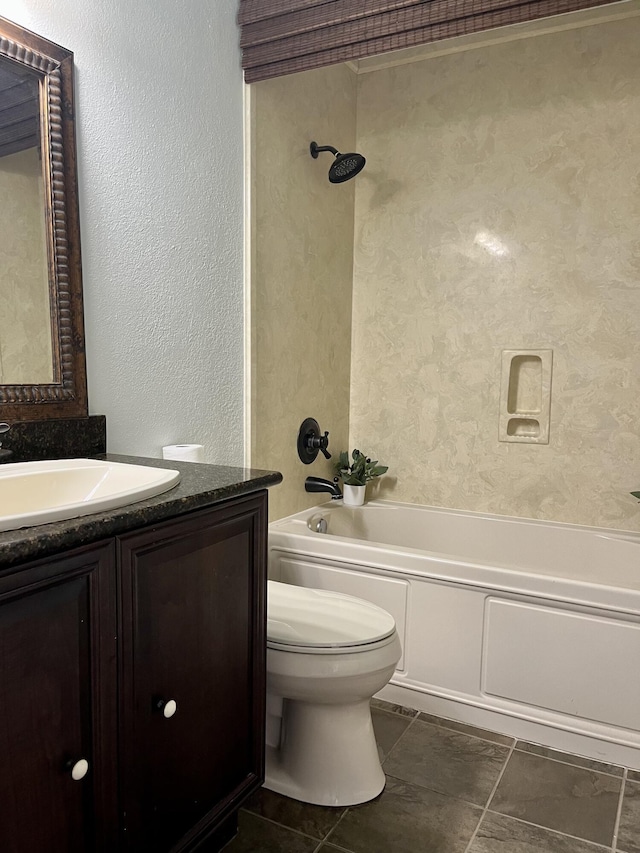 37 E Bradley St Unit 6, Miramar Beach, FL 32550 - full bathroom featuring a textured wall, toilet, vanity, and washtub / shower combination