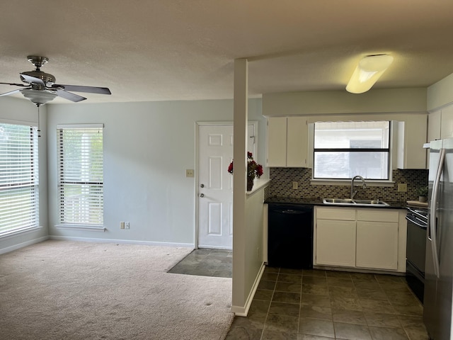 37 E Bradley St Unit 6, Miramar Beach, FL 32550 - kitchen featuring a sink, black dishwasher, freestanding refrigerator, a ceiling fan, and dark countertops