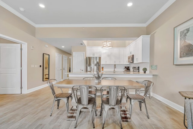 732 Scenic Gulf Dr Unit D103, Miramar Beach, FL 32550 - dining space featuring baseboards, light wood-style floors, and crown molding