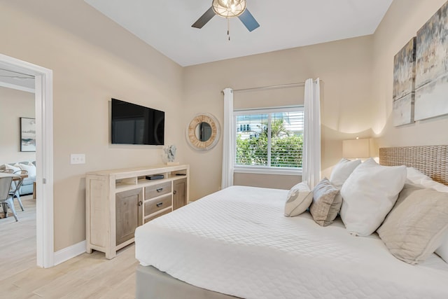 732 Scenic Gulf Dr Unit D103, Miramar Beach, FL 32550 - bedroom with baseboards, light wood-style flooring, and a ceiling fan
