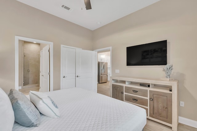 732 Scenic Gulf Dr Unit D103, Miramar Beach, FL 32550 - bedroom with stainless steel refrigerator with ice dispenser, ensuite bathroom, visible vents, baseboards, and ceiling fan
