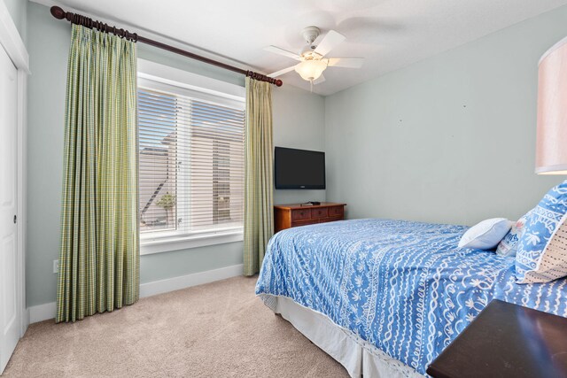 11807 Front Beach Rd # 1-309, Panama City Beach, FL 32407 - bedroom featuring a ceiling fan, carpet flooring, and baseboards