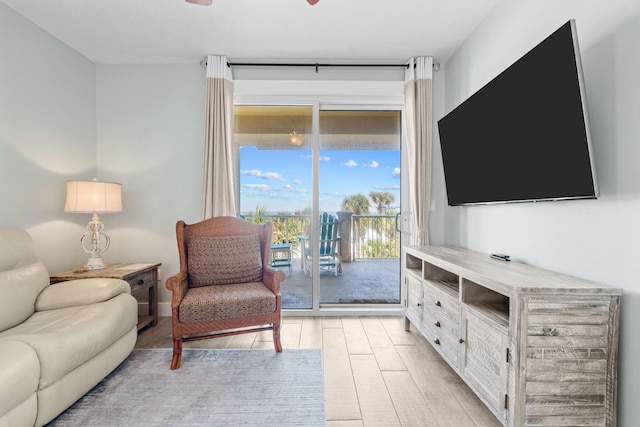 11807 Front Beach Rd # 1-309, Panama City Beach, FL 32407 - living area with light wood-type flooring and a ceiling fan