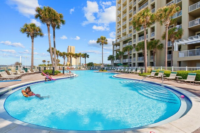 11807 Front Beach Rd # 1-309, Panama City Beach, FL 32407 - community pool featuring a patio area and fence