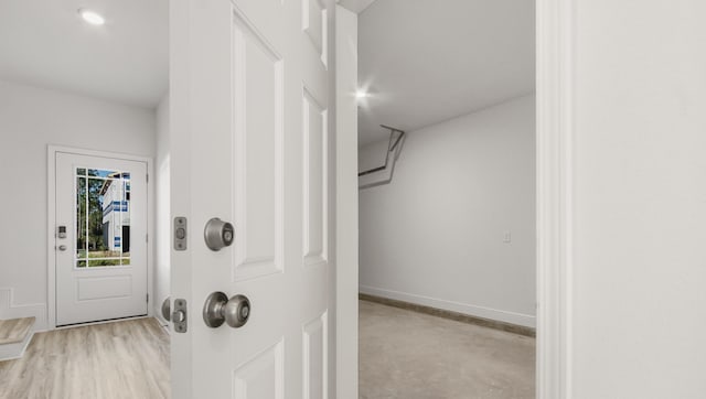 interior space featuring baseboards
