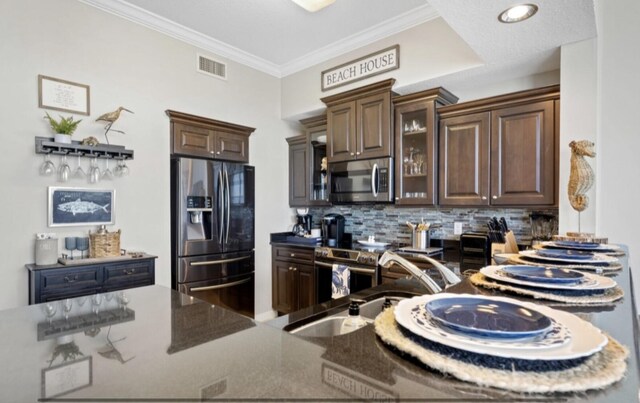 1517 Miracle Strip Pkwy Unit Ph01, Fort Walton Beach, FL 32548 - kitchen with backsplash, stainless steel appliances, visible vents, and a sink