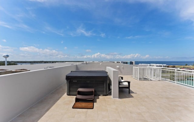 1517 Miracle Strip Pkwy Unit Ph01, Fort Walton Beach, FL 32548 - view of patio with a hot tub and a water view