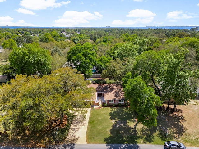 view from above of property featuring a heavily wooded area