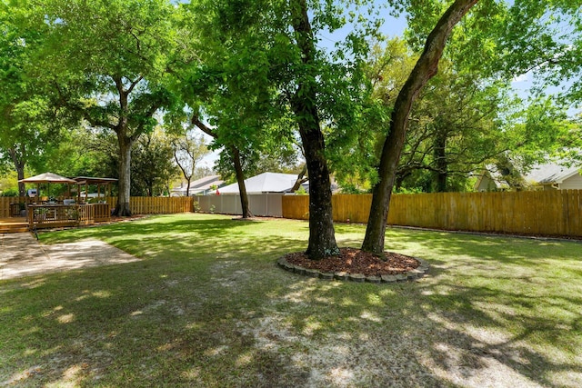 view of yard with a gazebo and a wooden deck