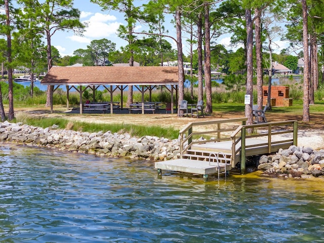 dock area with a gazebo and a water view