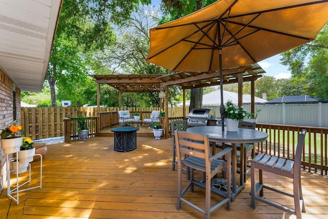 wooden terrace featuring outdoor dining space, a fenced backyard, a grill, and an outdoor living space with a fire pit