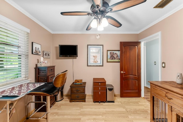 office area with light wood-style floors, ceiling fan, and crown molding