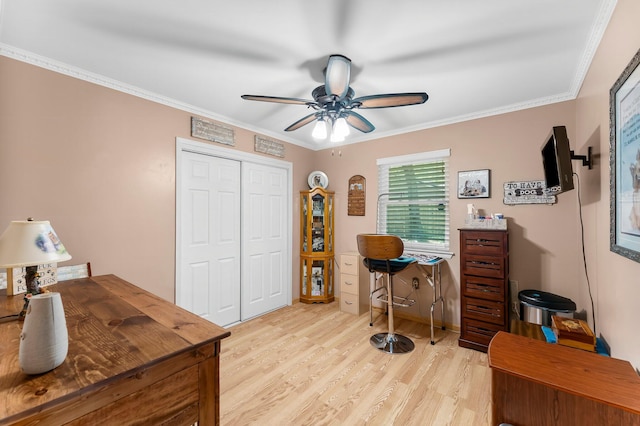 office space with ceiling fan, light wood finished floors, and ornamental molding